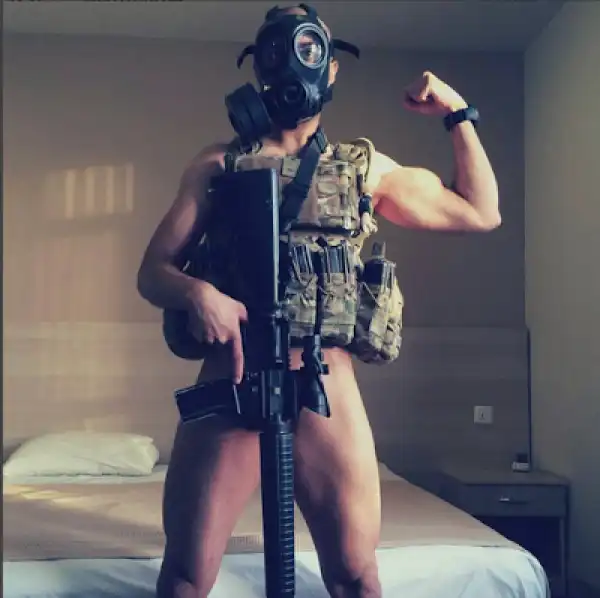 Photo: Soldier Comes Under Fire For Posing N*de With His Rifle